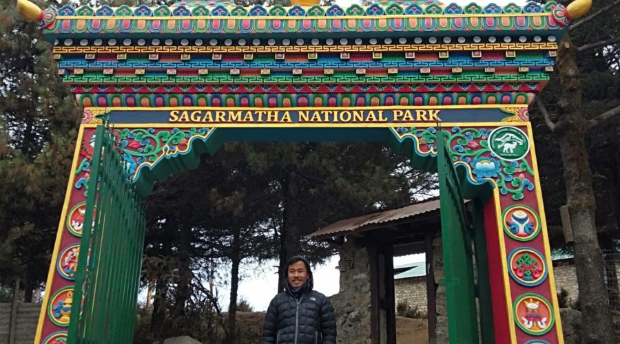 man standing in gate to sagarmatha national park
